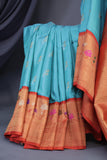 Aqua blue Gadwal saree with meenakari floral border in orange