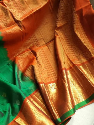Traditional Green and rust orange Kanchipattu saree