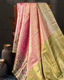 Stunning kanjeevaram in a dual tone peach pink color with meenakari border