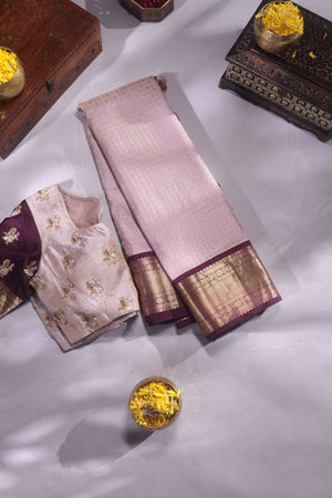 Kanchipattu saree in a lovely shade of light peach with a contrast dark maroon border