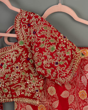 Red Banarasi saree with a heavy bridal zardosi work blouse