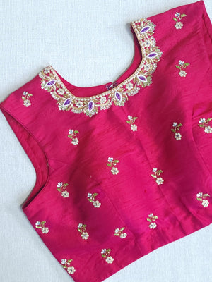 White floral pure silk saree with a contrast pink blouse