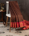 Brown kanjeevaram saree with a contrast dark pink border and Patola blouse