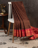 Brown kanjeevaram saree with a contrast dark pink border and Patola blouse