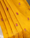 Yellow pure silk saree with contrast brown floral cutwork border