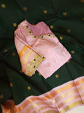 Kanjeevaram saree in bottle green with a baby pink border