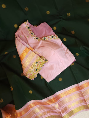 Kanjeevaram saree in bottle green with a baby pink border