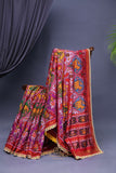 Patan Patola saree with intricately designed maggam work border