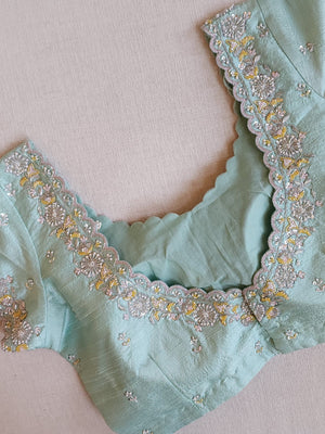 Pastel Blue soft organza saree with a mono tone blouse