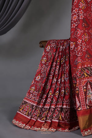 Patan Patola saree with intricately designed maggam work border