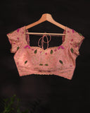 Soft organza saree in peach with a beautifully embroidered blouse