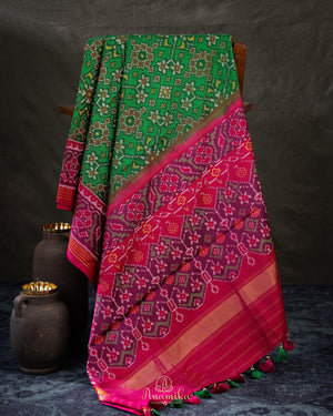 Pure Patola silk saree in a lovely shade of green and pink