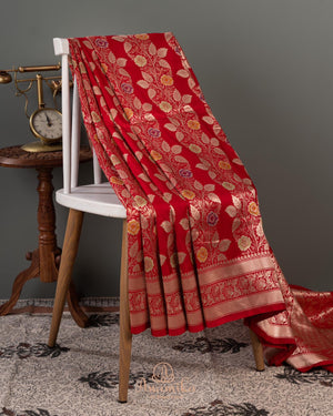 Red Banarasi saree with a heavy bridal zardosi work blouse