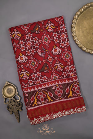 Patan Patola saree with intricately designed maggam work border