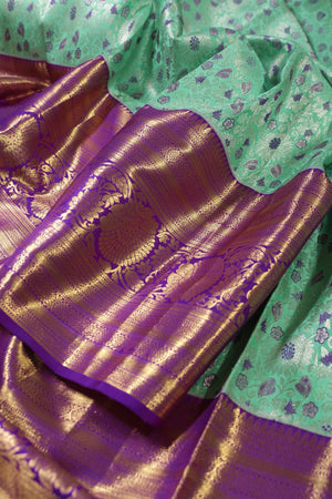 Mint Green Kanjeevaram saree with a purple border