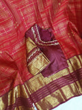 A stunning vintage kanjeevaram in rust orange with a deep maroon border