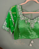 Parrot Green Crush Tissue saree with a stunning net sleeves blouse