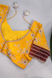 Radiant yellow Kanchipattu saree with maroon border