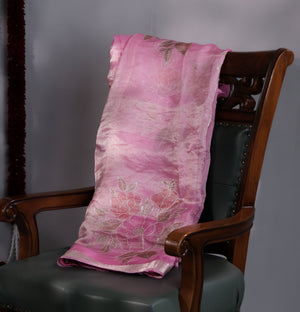 A beautiful rose pink tissue saree with an off white blouse