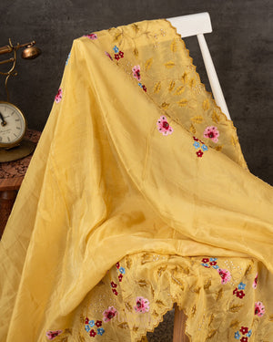 Lovely yellow tissue saree with beautiful thread embroidered border