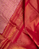 Light baby pink Kanchipattu saree with a contrast dark pink border