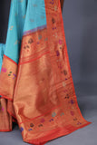 Aqua blue Gadwal saree with meenakari floral border in orange