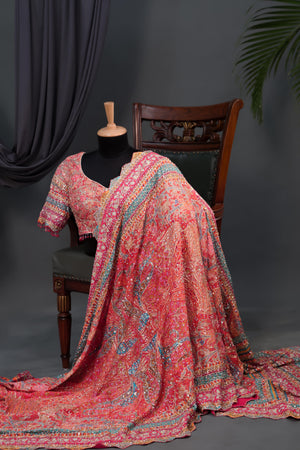Designer Georgette Saree in hues of orange, peach, red and pink