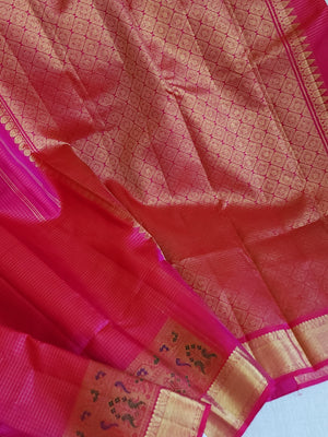 Kanjeevaram in a beautiful shade of majenta with a woven paithani styled border