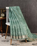 Organza saree in sage green with all over thread embroidery