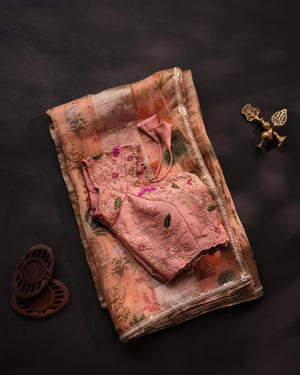 Soft organza saree in peach with a beautifully embroidered blouse