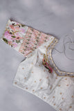 A beautiful rose pink tissue saree with an off white blouse