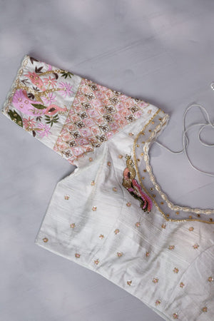 A beautiful rose pink tissue saree with an off white blouse