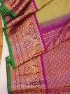 Royal Gadwal kanchiPattu saree in a beautiful parrot green and magenta combination