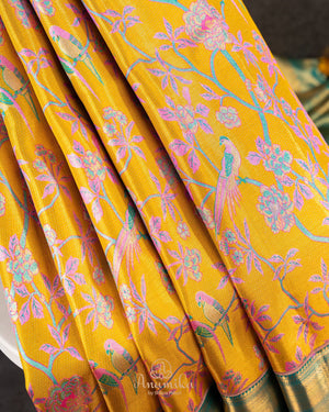 A meenakari kanjeevaram saree in yellow and teal