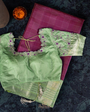 A kanjeevaram saree in purple with pastel green combo