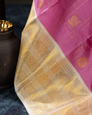 Kanjeevaram saree in a lovely shade of baby pink and off white pastels