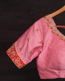 Raw Mango saree in red paired with a pink blouse