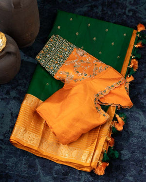 Kanchi soft silk saree in an evergreen green and light orange combo