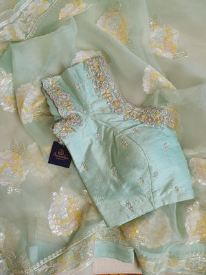 Pastel Blue soft organza saree with a mono tone blouse