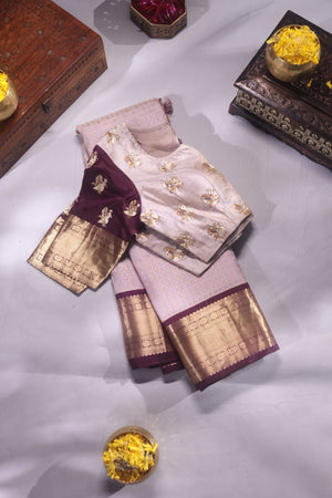 Kanchipattu saree in a lovely shade of light peach with a contrast dark maroon border