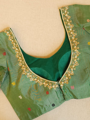 Gadwal saree in peach with beautiful contrast green temple borders