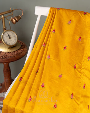 Yellow pure silk saree with contrast brown floral cutwork border