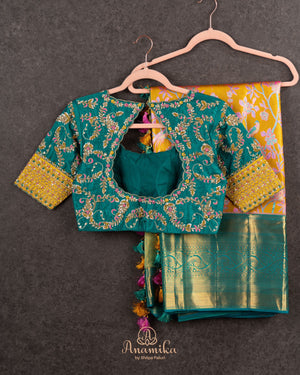 A meenakari kanjeevaram saree in yellow and teal