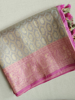 Kanjeevaram in a beautiful shade of gray with a contrast pink border.