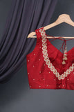 Red sleeveless blouse with handwork