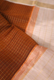 A beautiful vintage kanjeevaram in coppery rust with an ivory border