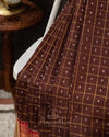 Brown kanjeevaram saree with a contrast dark pink border and Patola blouse