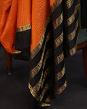 Orange mysore crepe silk saree with a stunning blouse pattern