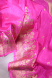 Raw Mango saree in bubble gum pink paired with a contrast dark green blouse