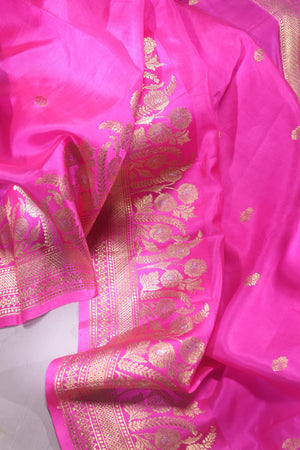 Raw Mango saree in bubble gum pink paired with a contrast dark green blouse